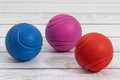 Игрушка для собак мяч NUNBELL литой 7 см пружинистый 10920-0031